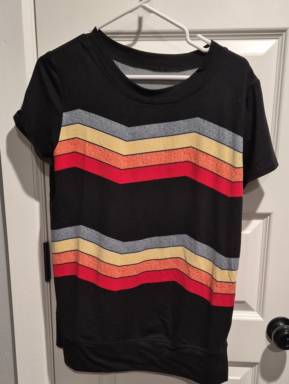 Black Tee with Chevron Stripes in Red, Gold, Gray
